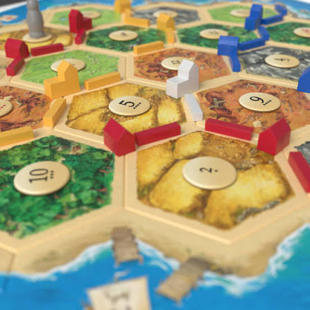 Catan strategy board game box and game components
